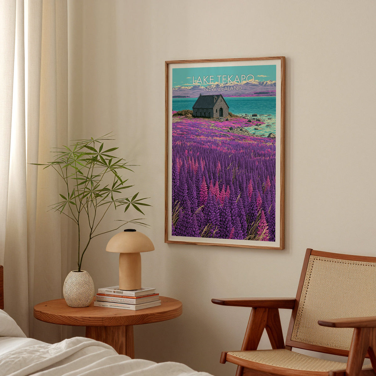 Snowy range and lupins art in oak above a bedside table with a mushroom lamp and bamboo stems
