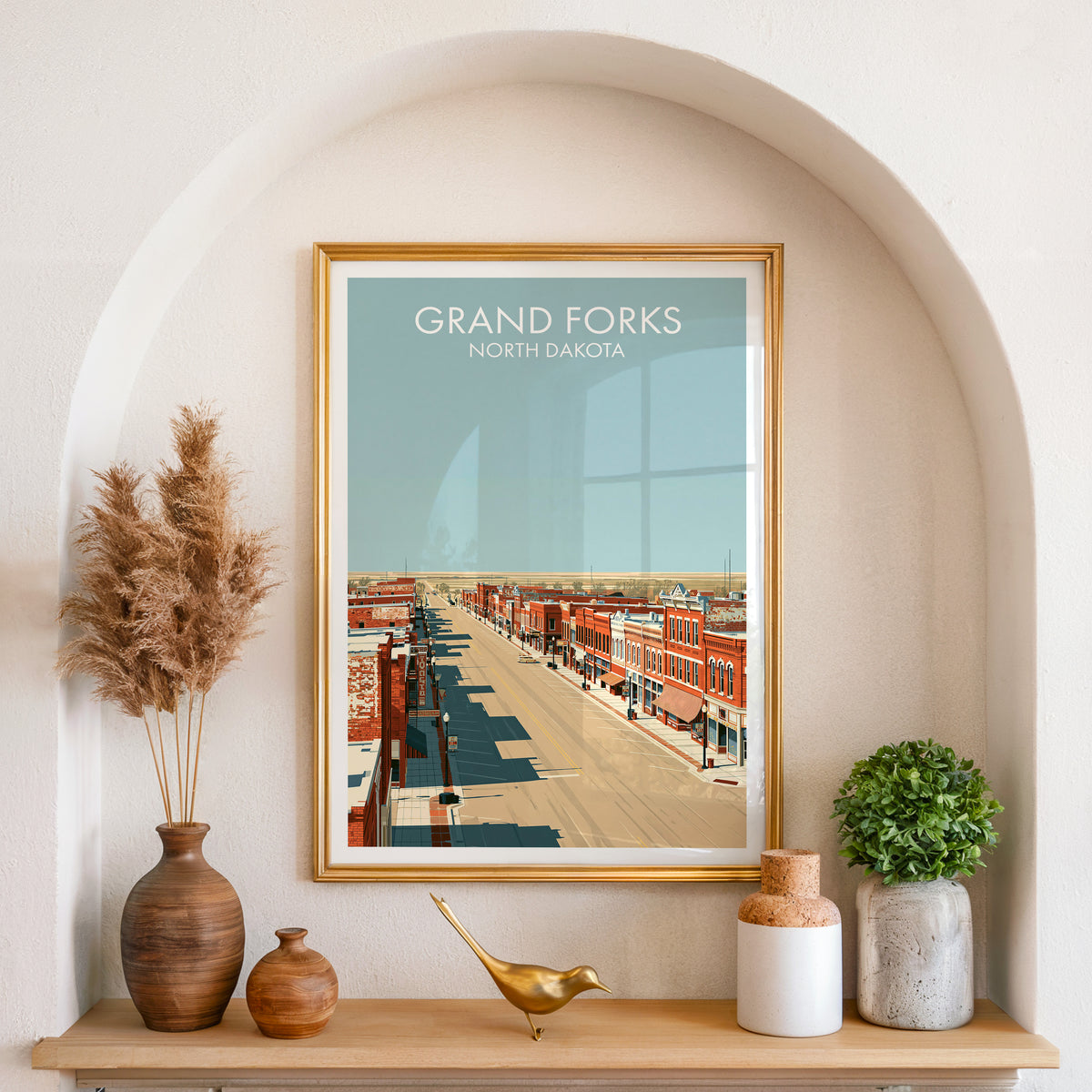 Prairie main street print in a gold frame in an arched niche with pampas grass