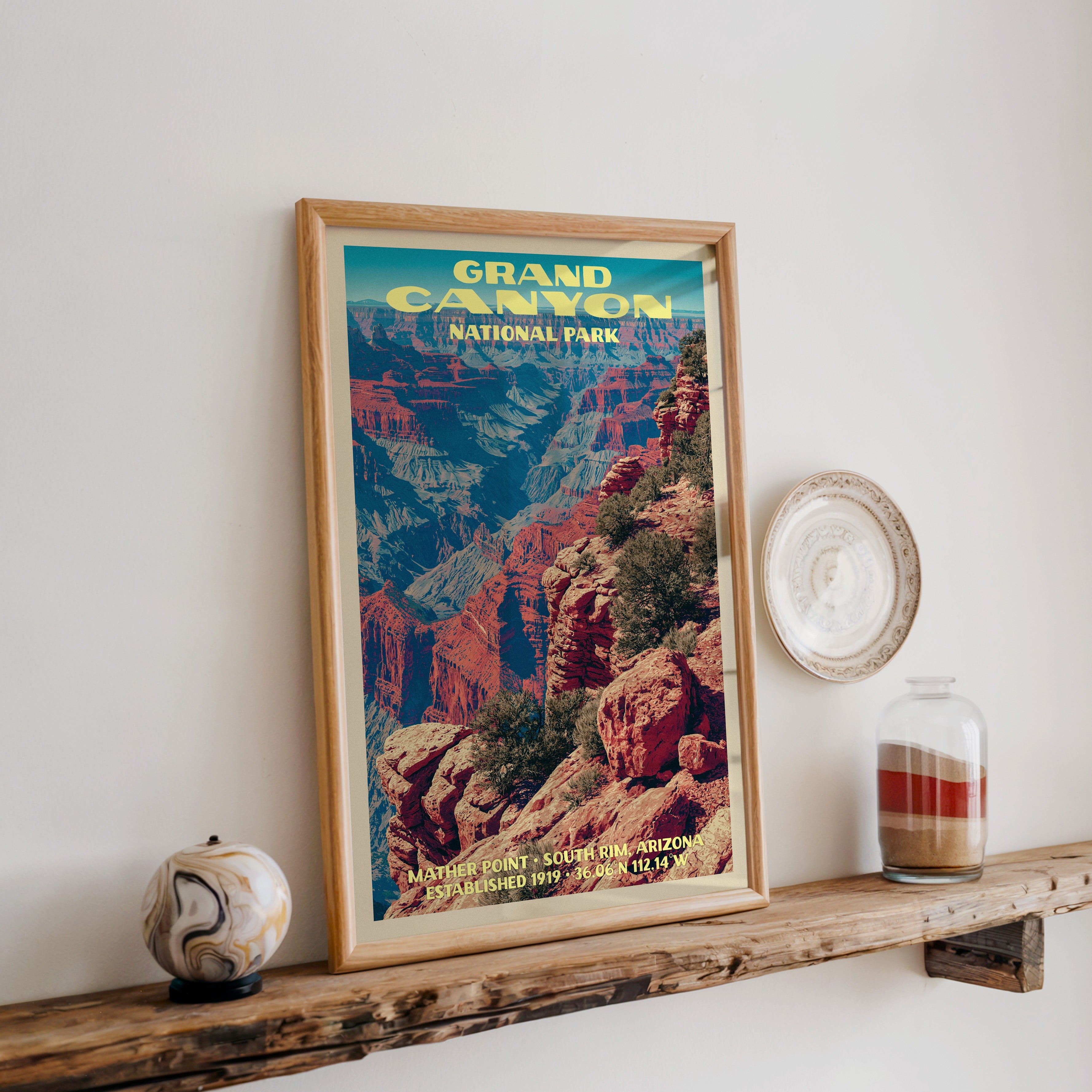 Grand Canyon Mather Point print in oak, leaning on a reclaimed wood ledge with a stone sphere and sand jar