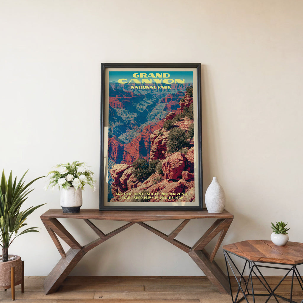 Grand Canyon Mather Point wall art in black, leaning on a walnut console with white anemones in a vase
