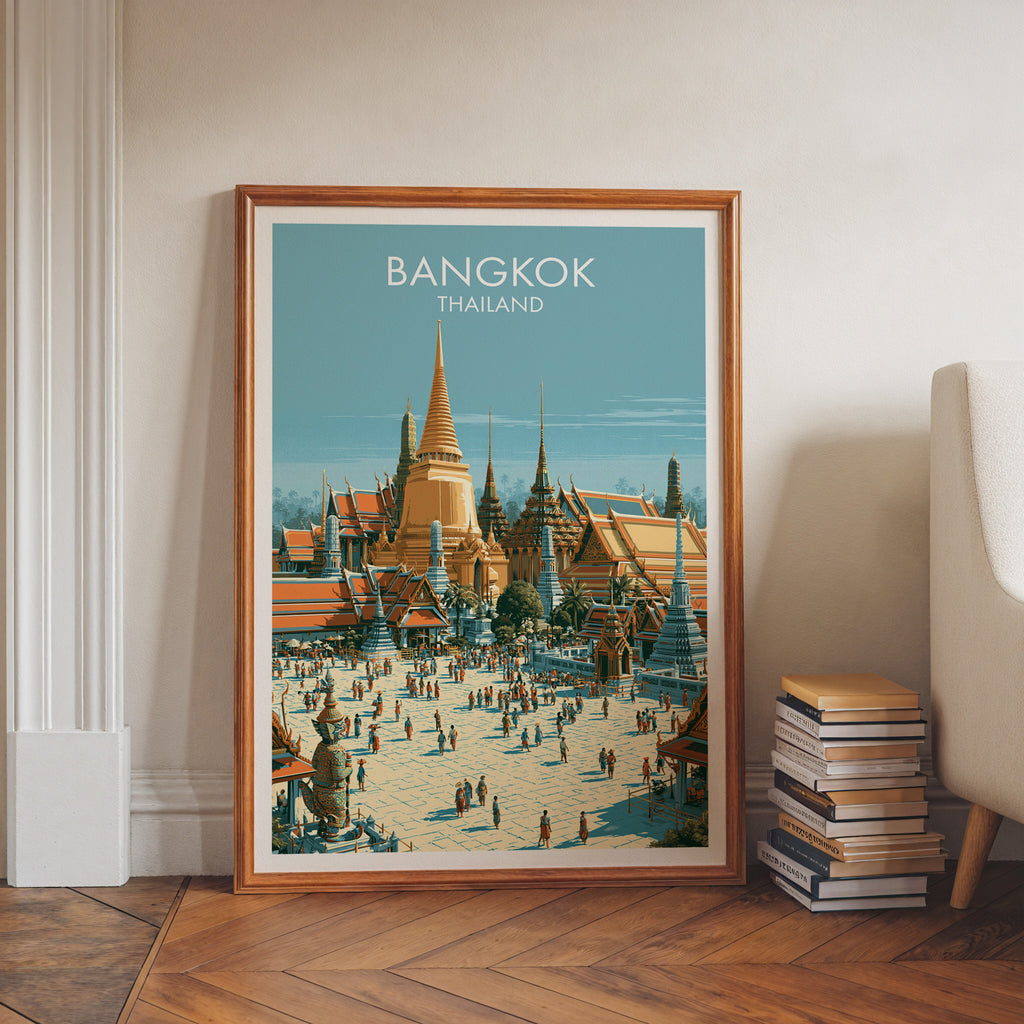 Grand Palace Bangkok Thailand art print in a walnut frame leaning in a hallway beside stacked books