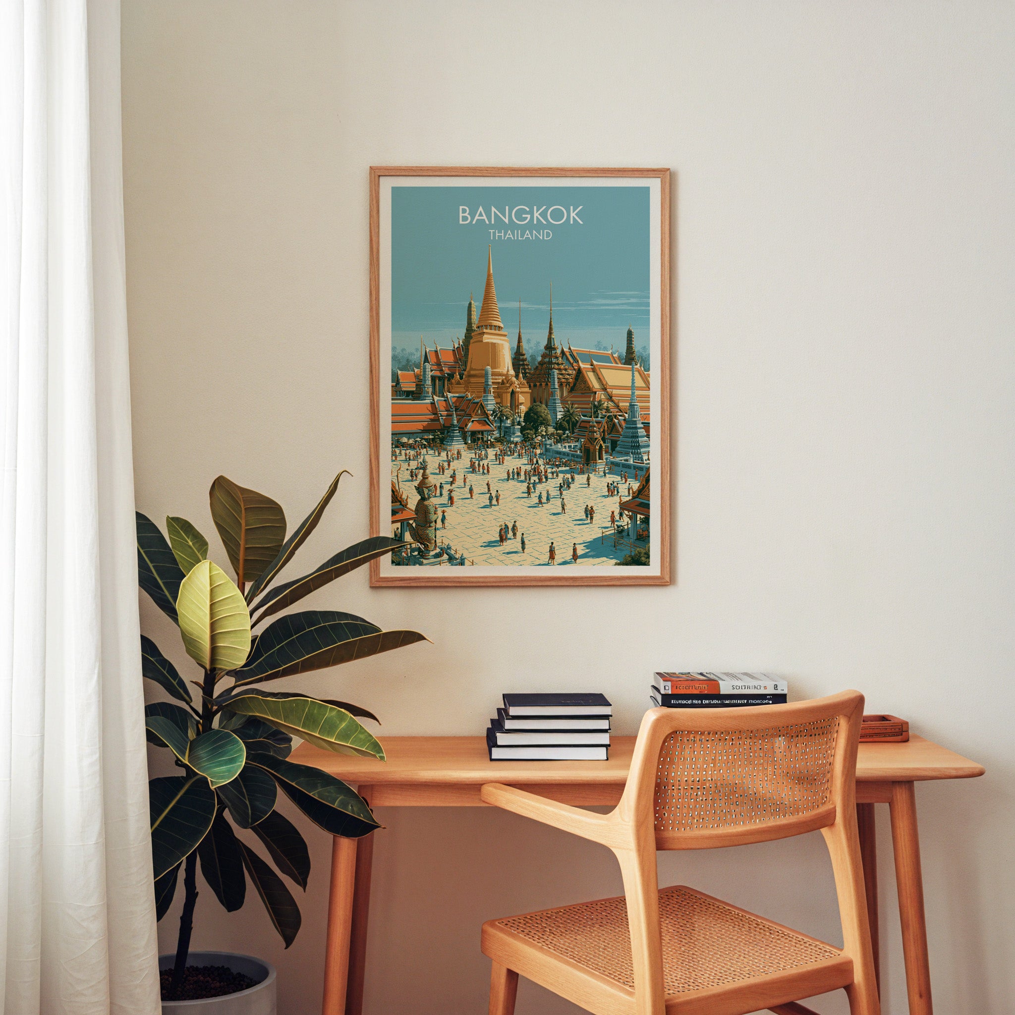 Grand Palace Bangkok Thailand wall art above a wooden home office desk with a rattan chair and books