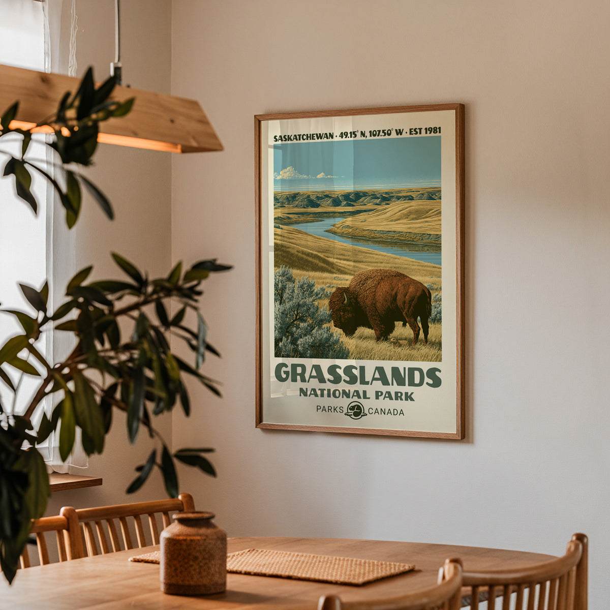 Grasslands prairie bison poster in an oak frame in a dining corner above an oak table