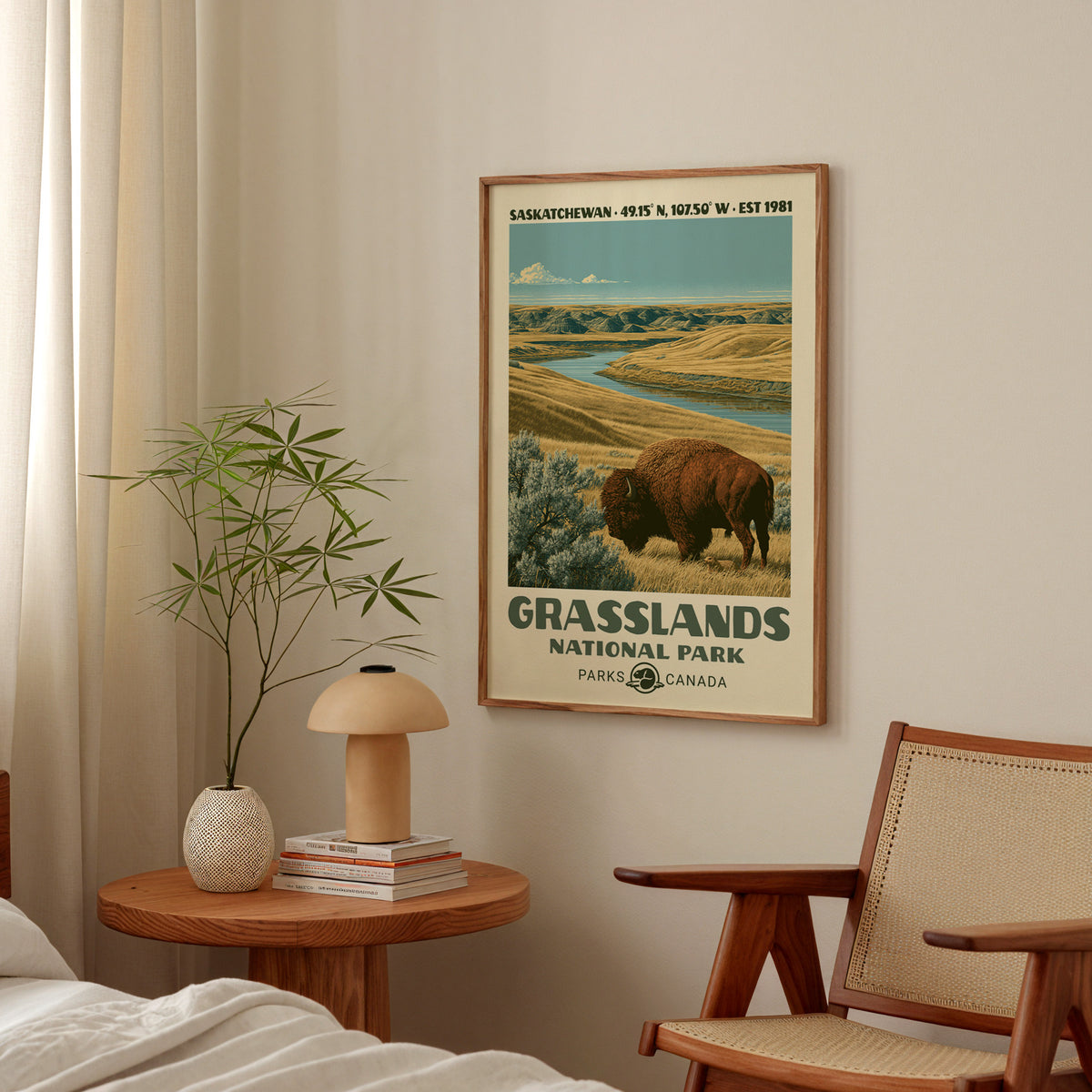 Grasslands prairie bison poster in an oak frame above a bedside table with a mushroom lamp