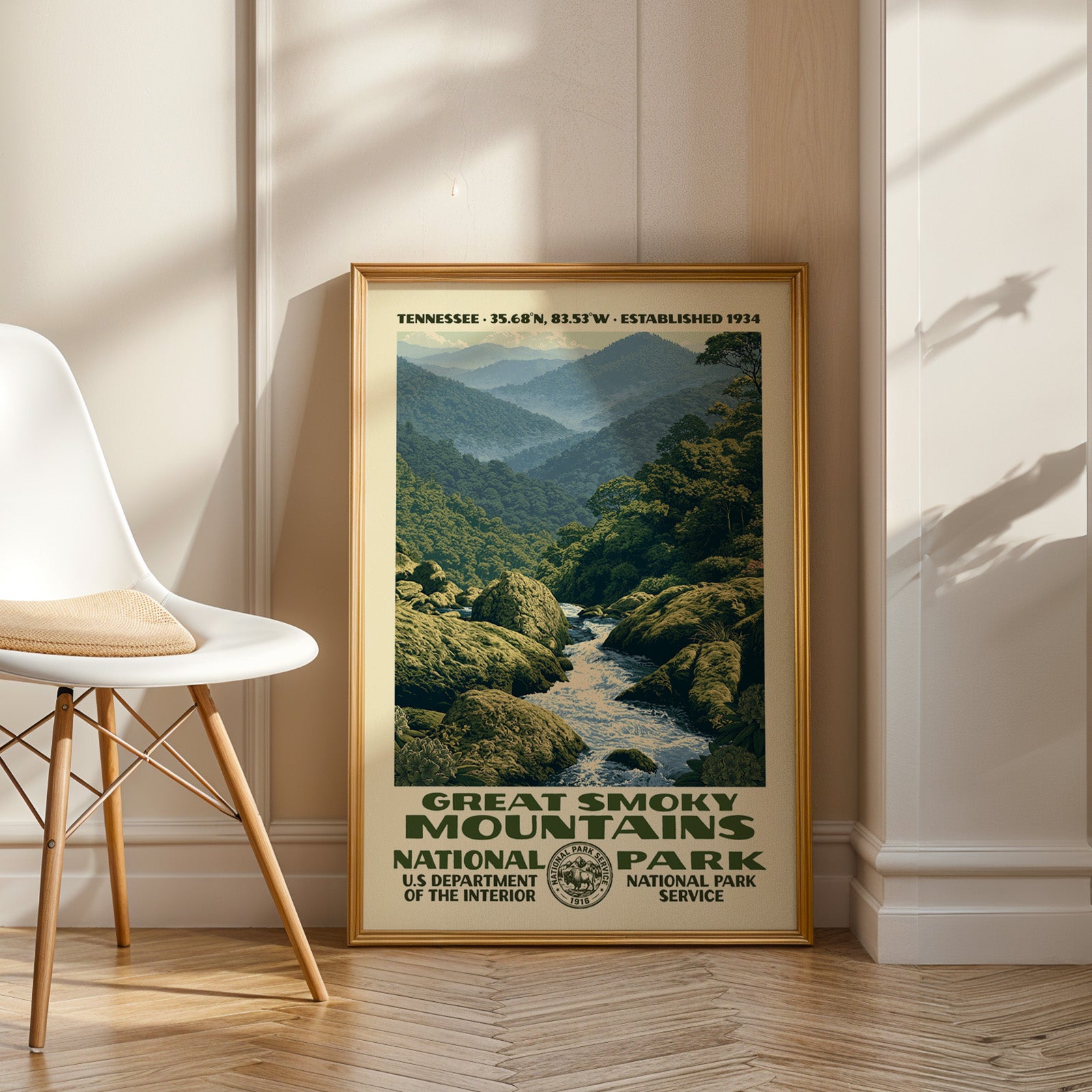 Great Smoky Mountains National Park vintage WPA art in an oak frame leaning by a white chair on a wood floor