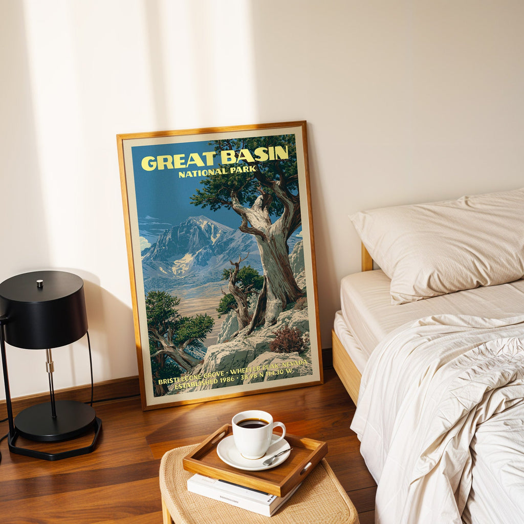 Bristlecone Grove poster in a gold frame on the bedroom floor beside a made bed and a black table lamp