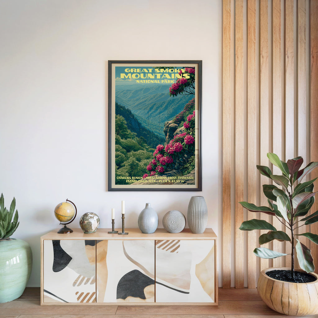 Great Smoky Mountains National Park poster in a black frame above a light wood sideboard with a globe and a candlestick