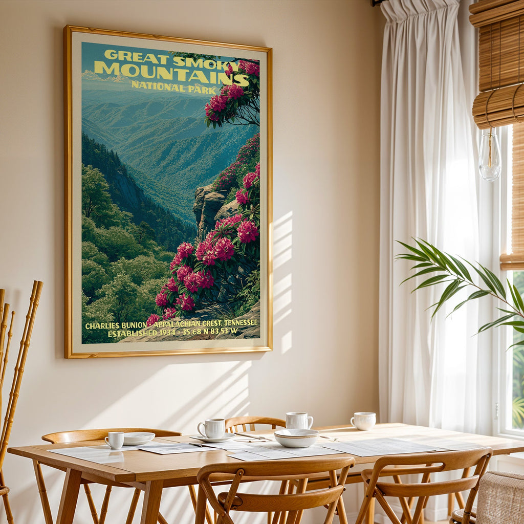 Great Smoky Mountains National Park print in a gold frame above a light oak dining table by a curtained window