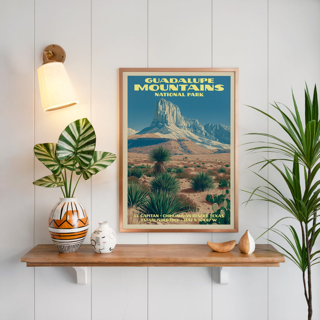Guadalupe Mountains print framed on white panelling above a floating oak shelf with a patterned vase and sconce