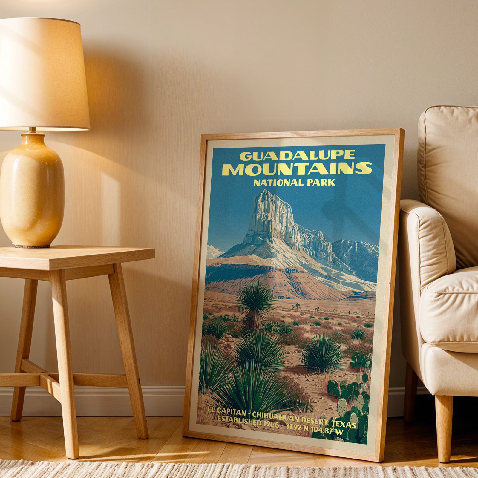 Chihuahuan Desert wall art in oak, leaning by a cream armchair and a side table with an ochre ceramic lamp