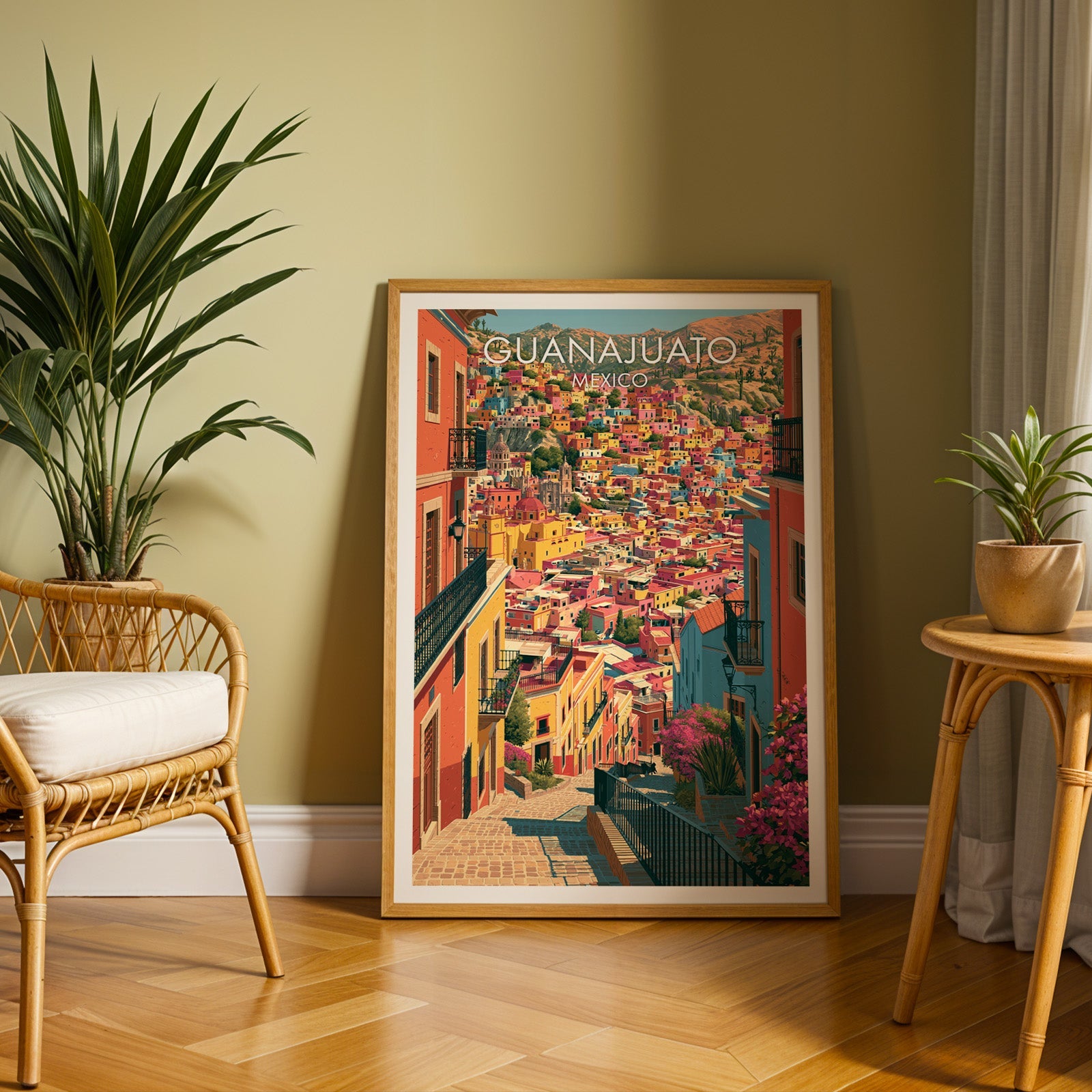 Coral and mustard street scene in an oak frame on herringbone parquet, rattan chair and olive wall