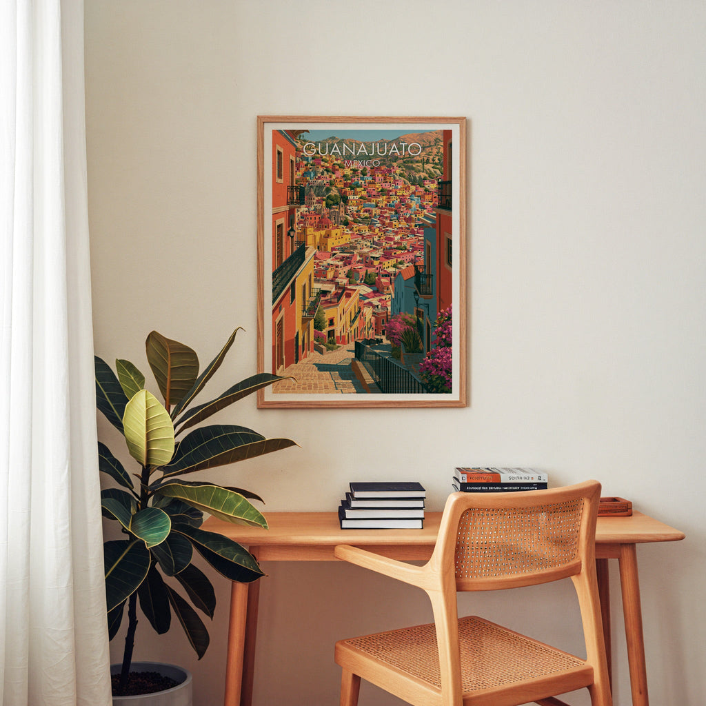Church domes above stacked houses, oak frame over a home-office desk with a cane chair and rubber plant