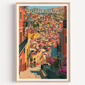 Guanajuato hillside houses print in a light oak frame on a plain white wall