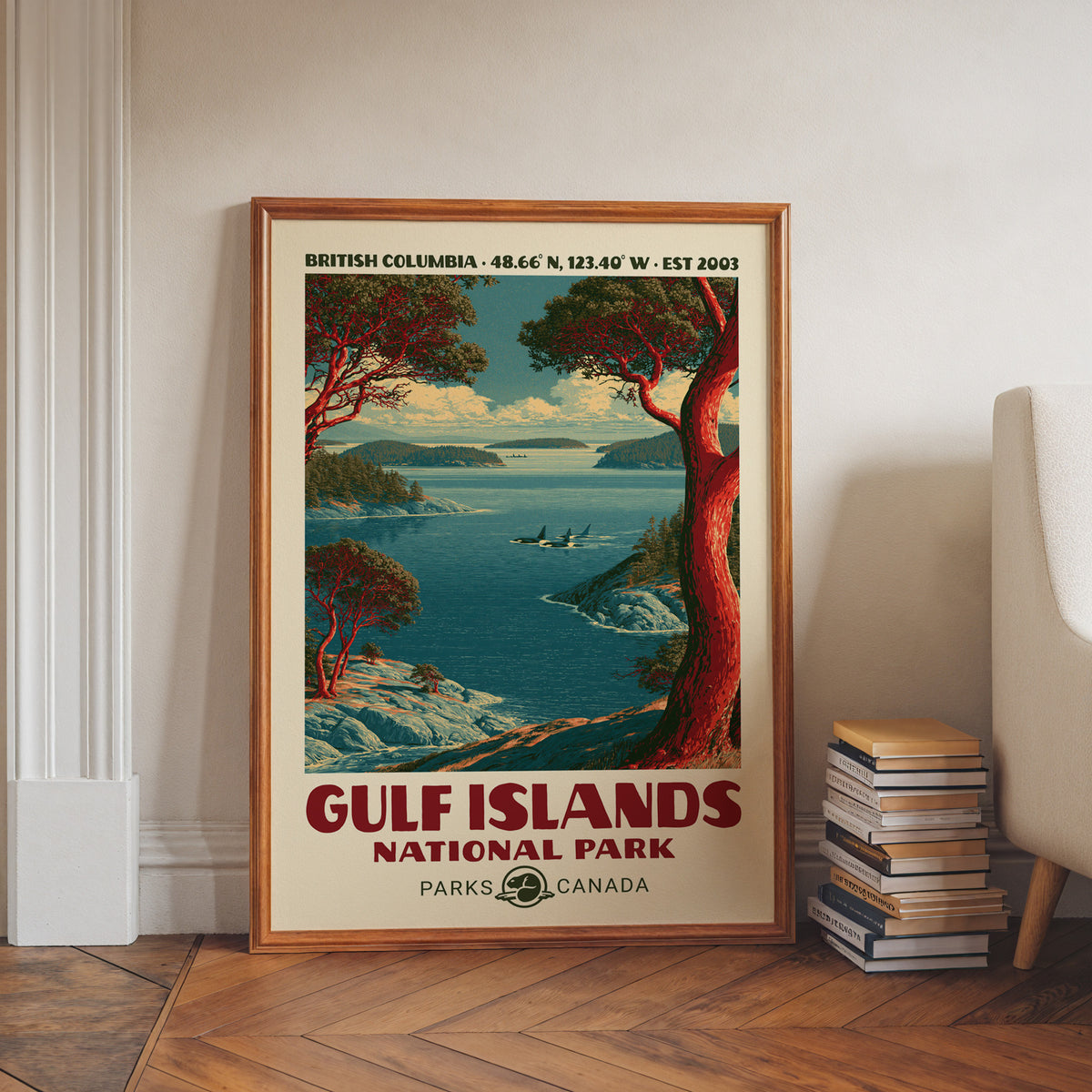 Gulf Islands National Park wall art, BC in a walnut frame on a herringbone floor beside stacked books