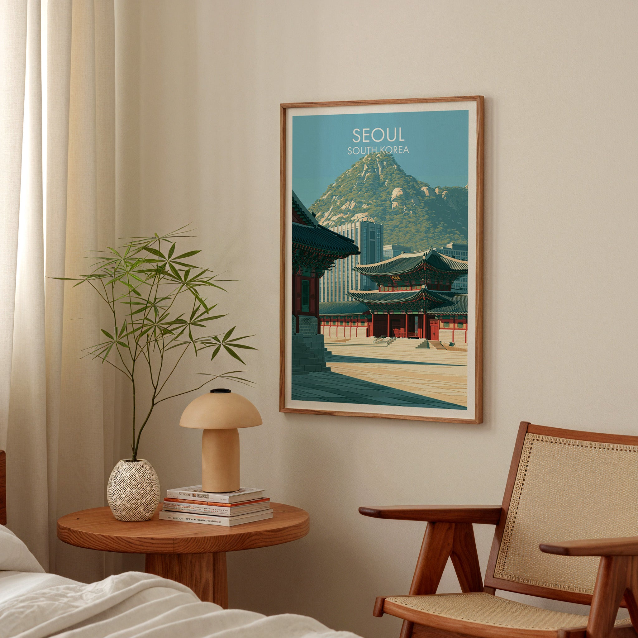 Gyeongbokgung Palace Seoul poster above a bedroom nightstand with a bamboo plant and mushroom lamp