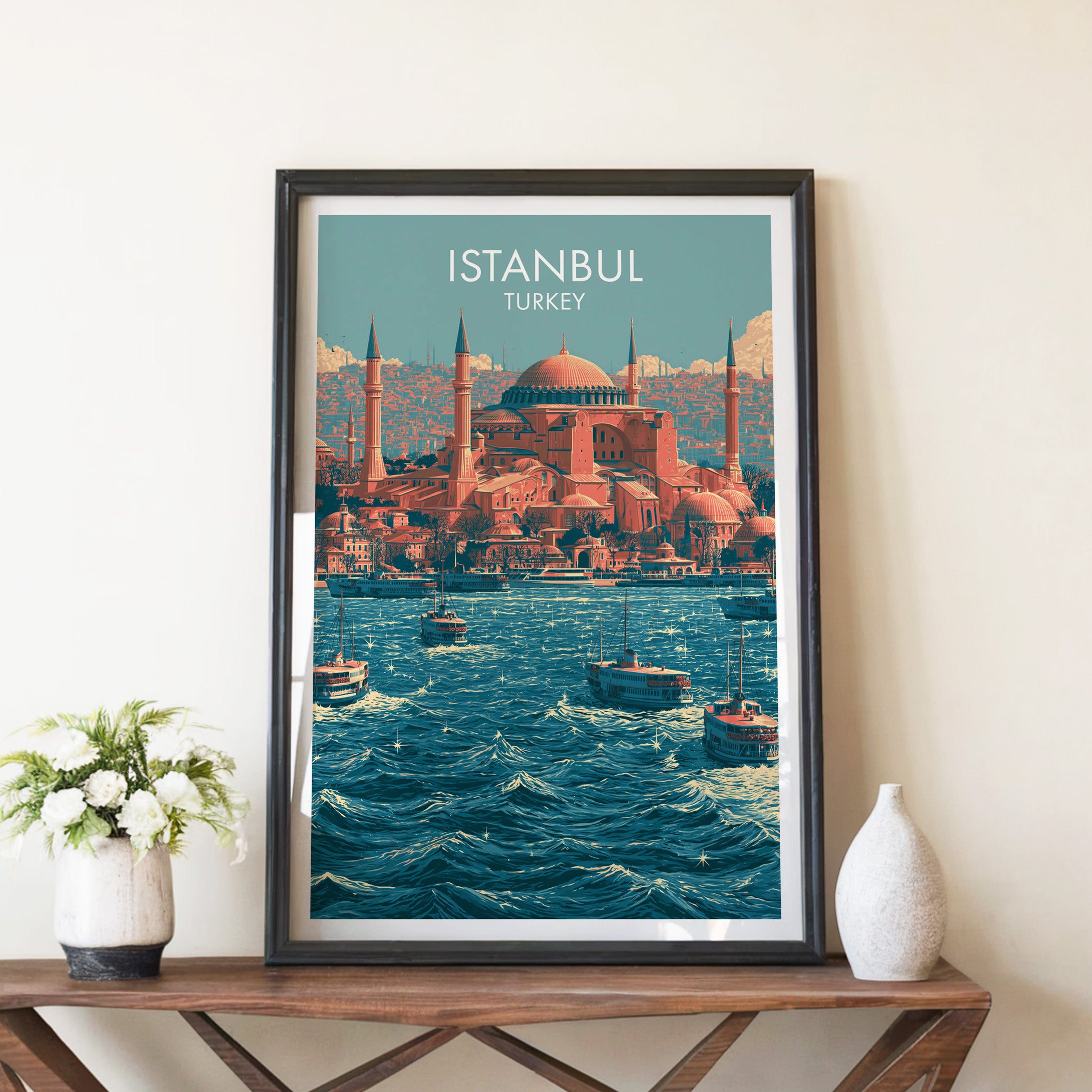 Hagia Sophia Istanbul Turkey travel poster in a black frame on a wooden console table with white flowers