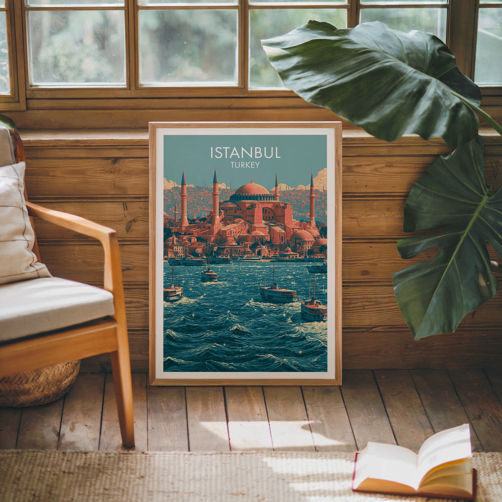 Framed Hagia Sophia Istanbul Turkey poster leaning against a timber cabin wall with monstera leaves and an open book