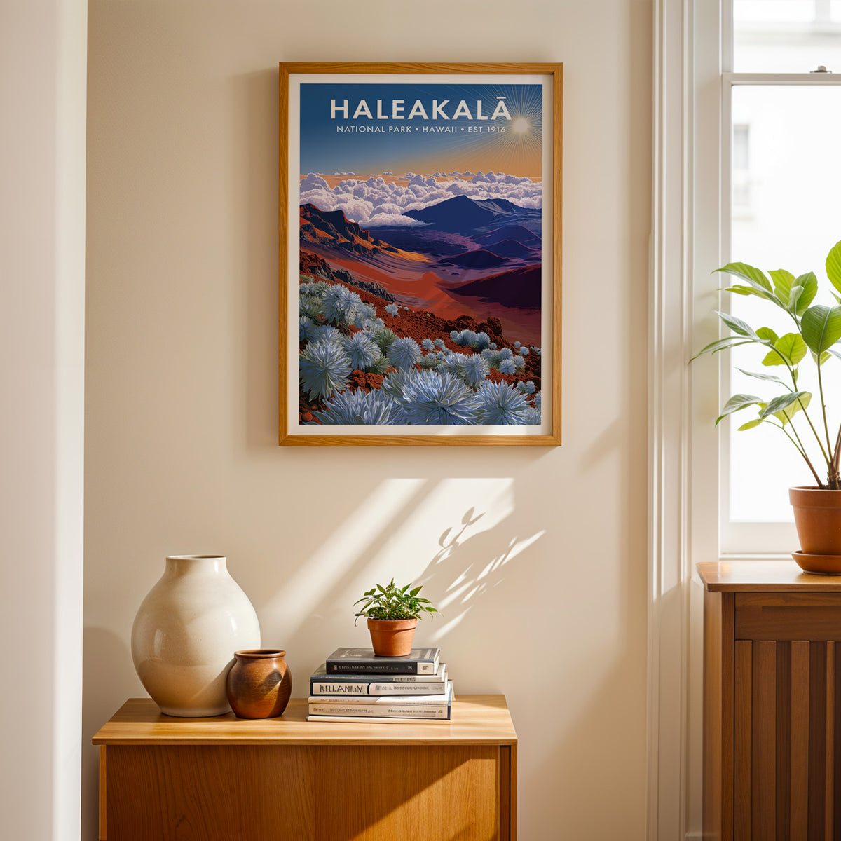 Haleakalā National Park mid-century modern art print framed above a wood console with a ceramic vase and books — entryway wall art