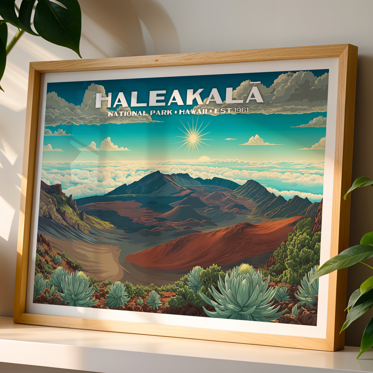 Haleakalā National Park wall art print in a light oak frame, leaning on a white shelf in warm sunlight beside a monstera plant