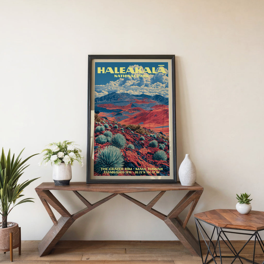Crater Rim silversword wall art in a black frame, leaning on a walnut console with white anemones in a vase