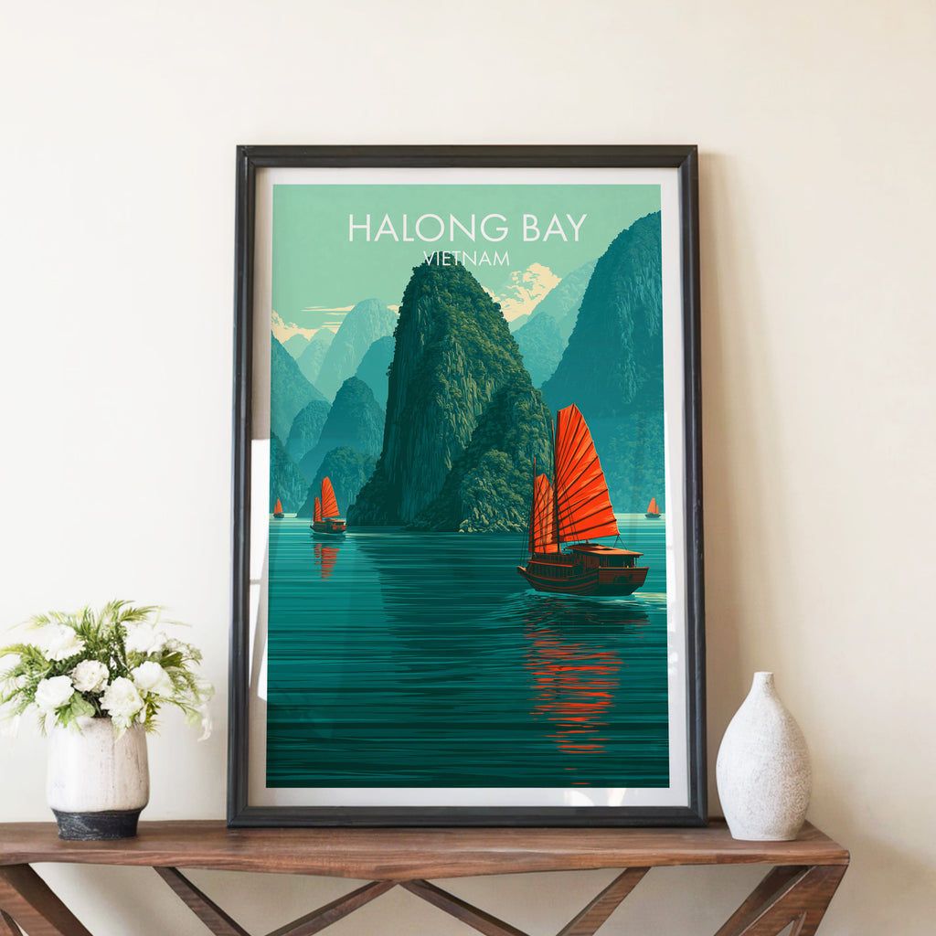 Halong Bay Vietnam travel poster in a black frame on a wooden console table with white flowers