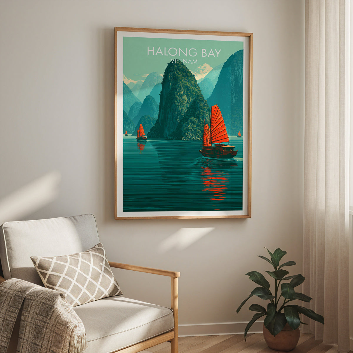 Halong Bay travel print in an oak frame above a cream armchair with sheer curtains and a rubber plant