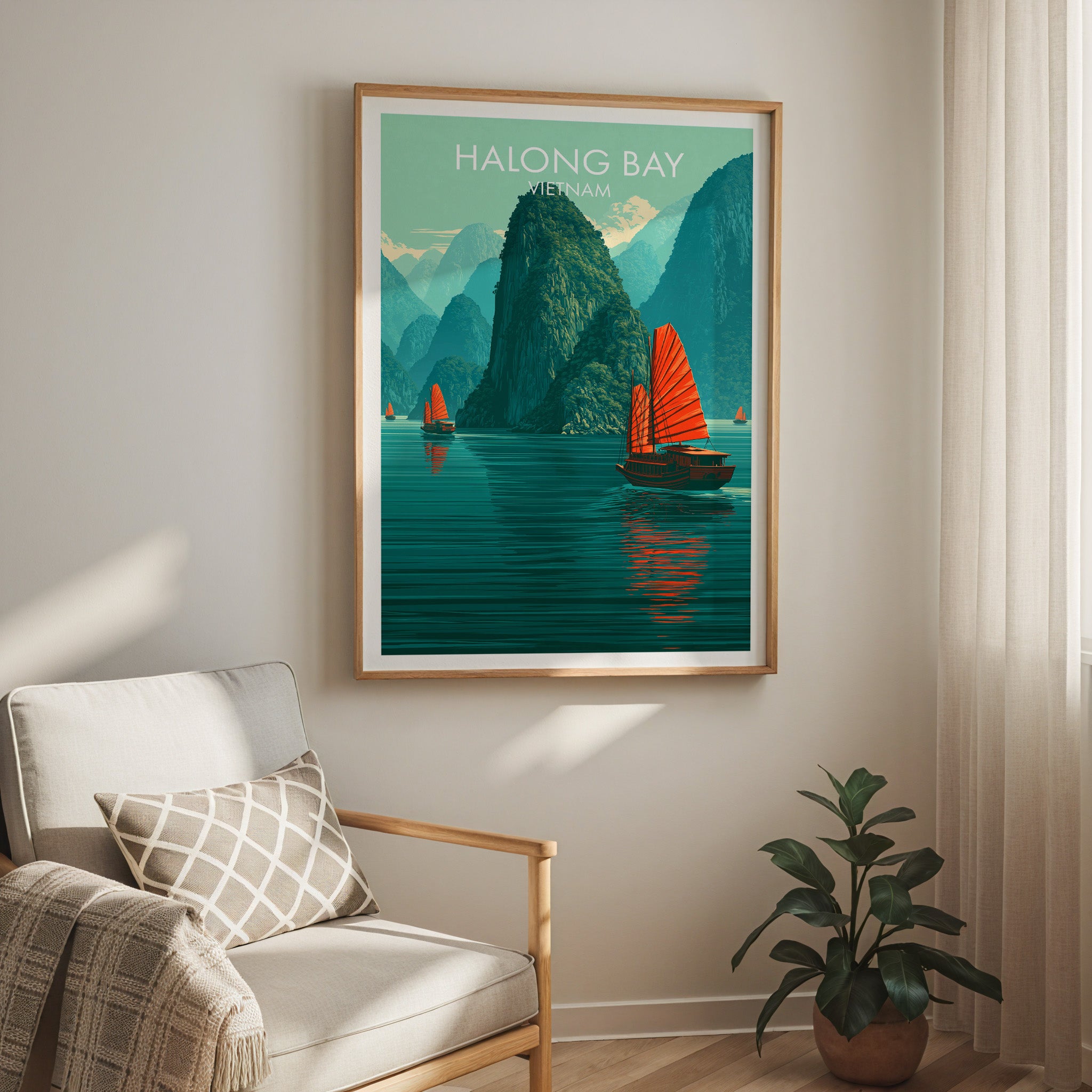 Halong Bay Vietnam travel print in a light oak frame on a living room wall beside a linen armchair
