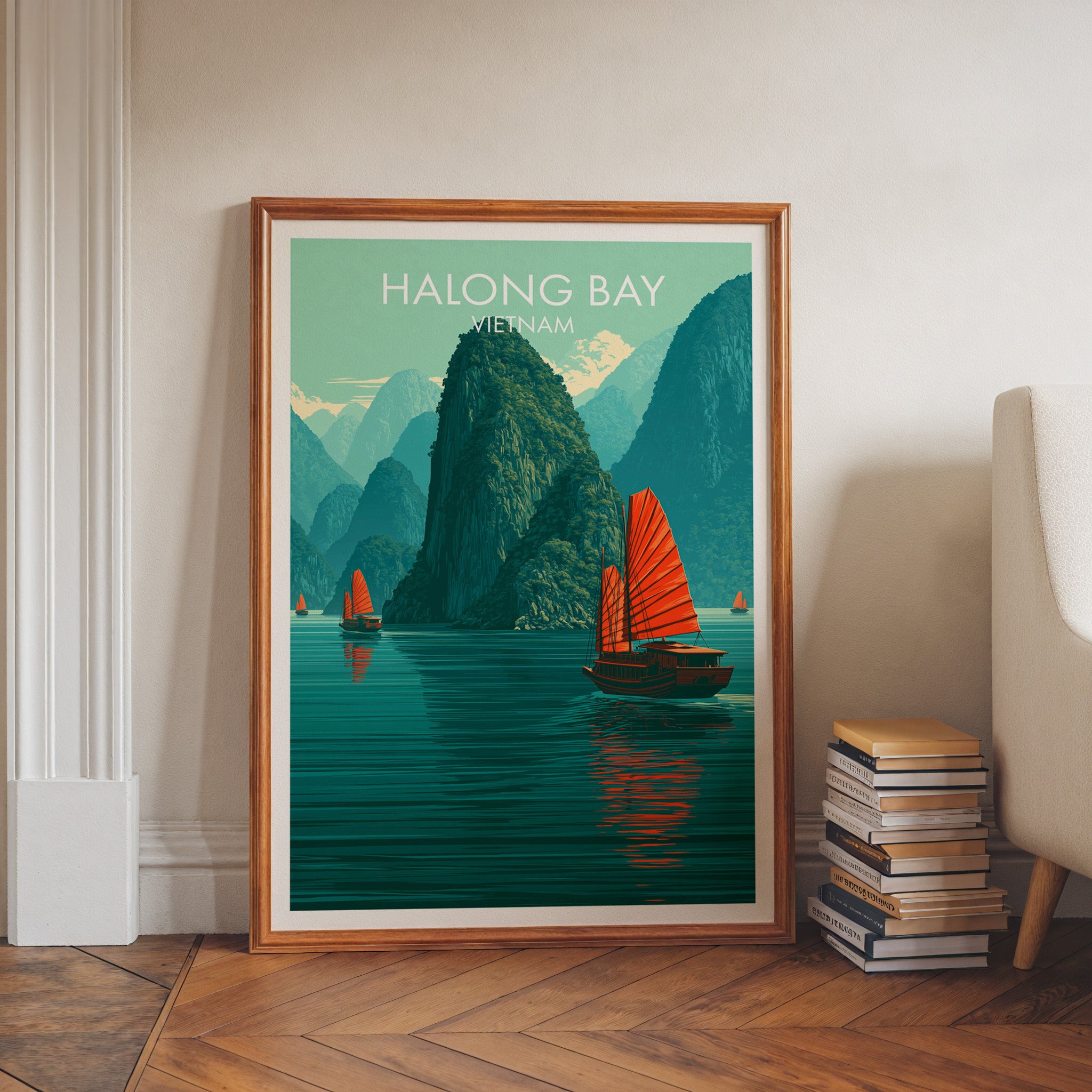 Halong Bay Vietnam art print in a walnut frame leaning in a hallway beside stacked books