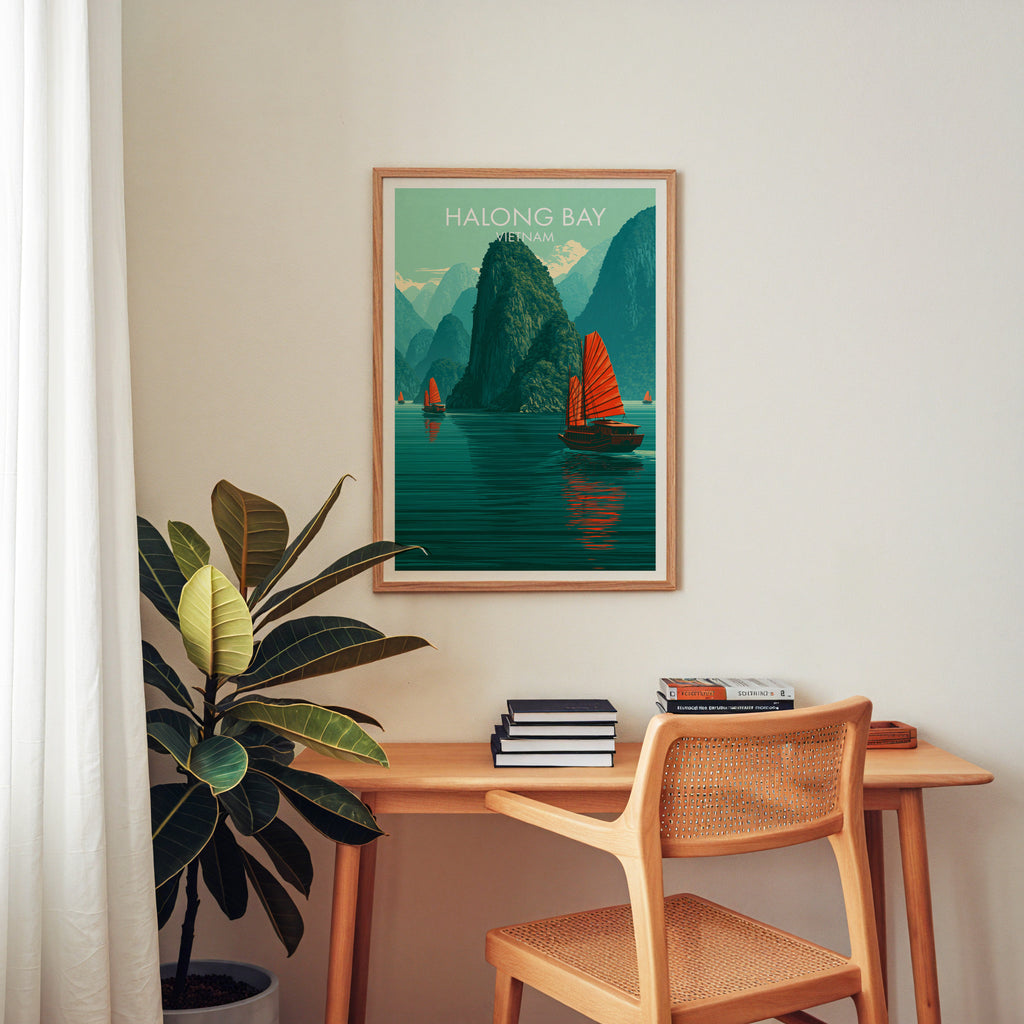 Halong Bay Vietnam wall art above a wooden home office desk with a rattan chair and books
