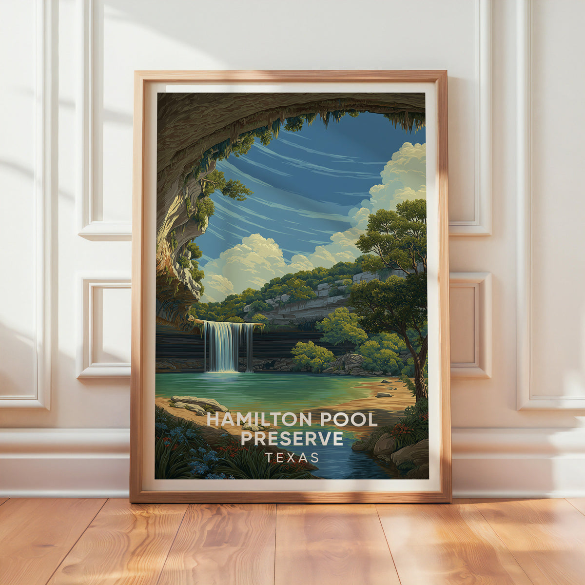 Hamilton Pool grotto artwork in oak leaning on a panelled white wall in window light on wood floor