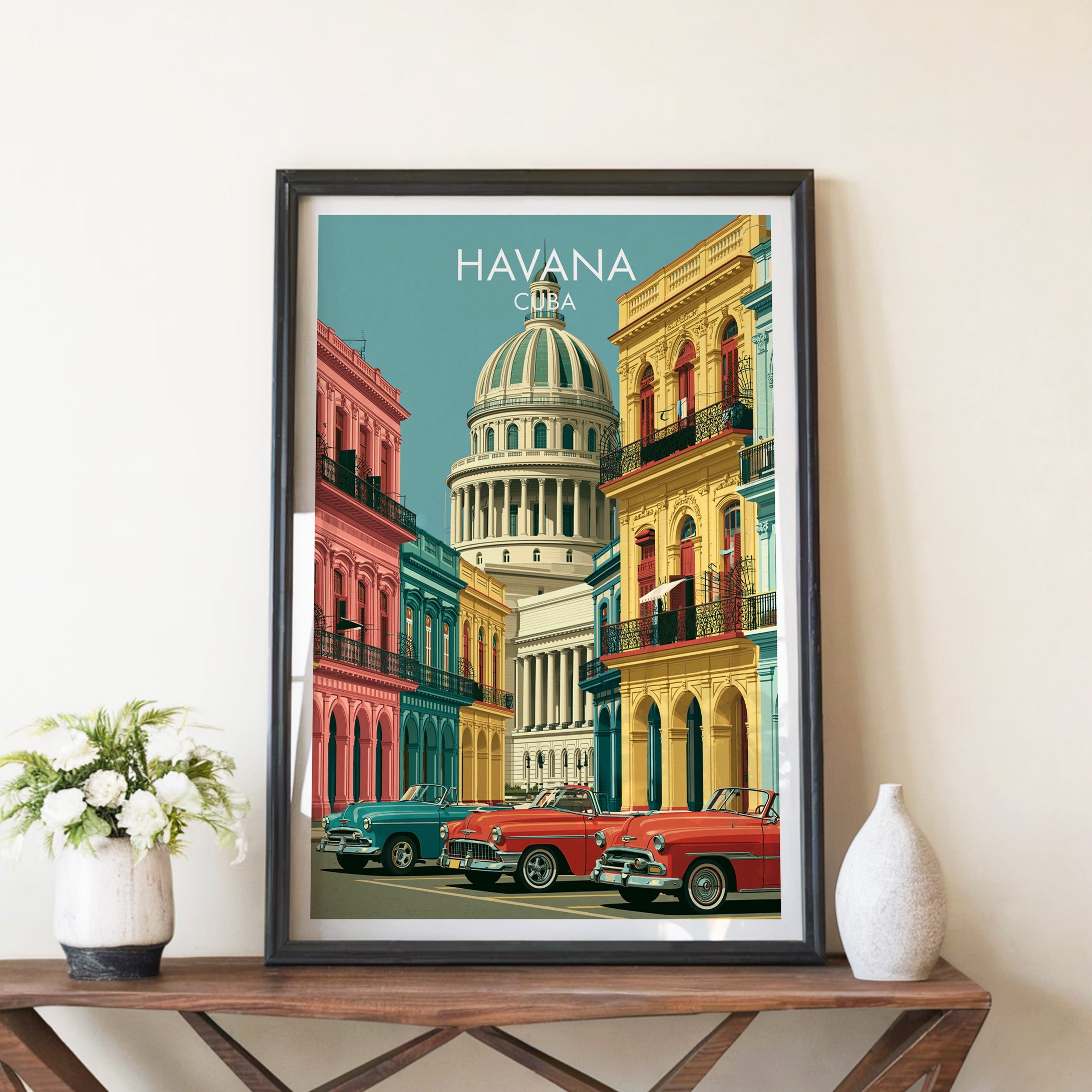 Capitolio dome poster in a black frame on a walnut console between white peonies in a stone vase and a white vase