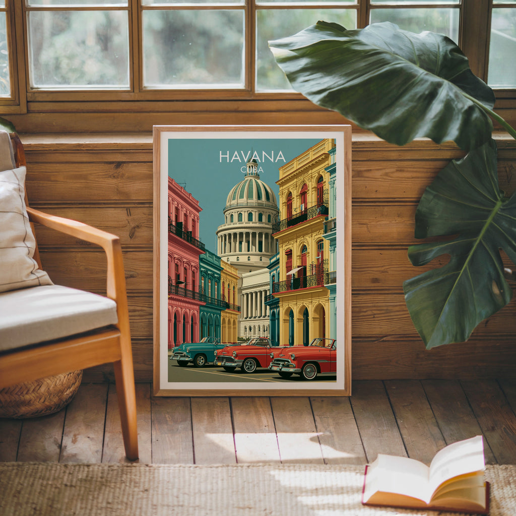 Cuba travel art in an oak frame leaning on a pine cabin wall, wooden armchair, monstera leaf, jute rug and book