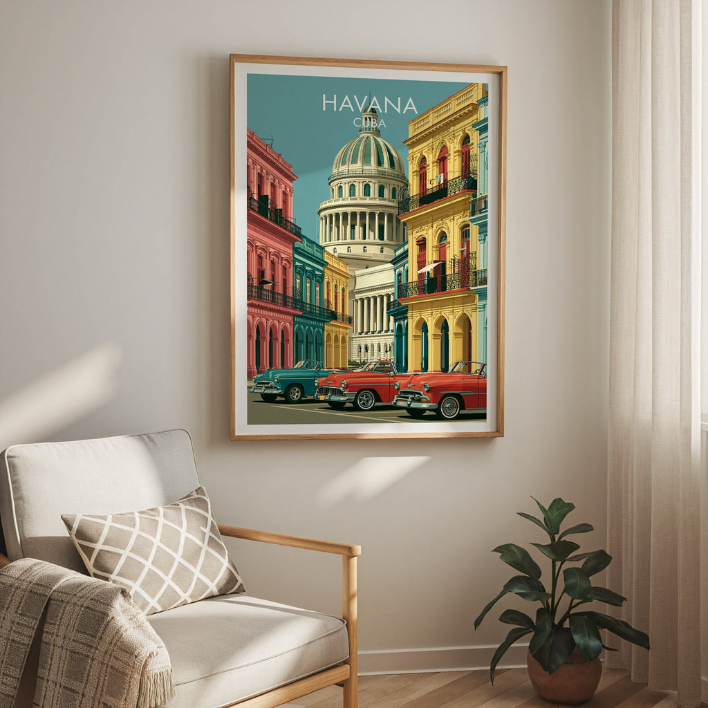 Havana street scene in an oak frame above a cream armchair with a check cushion, sheer curtain and rubber plant