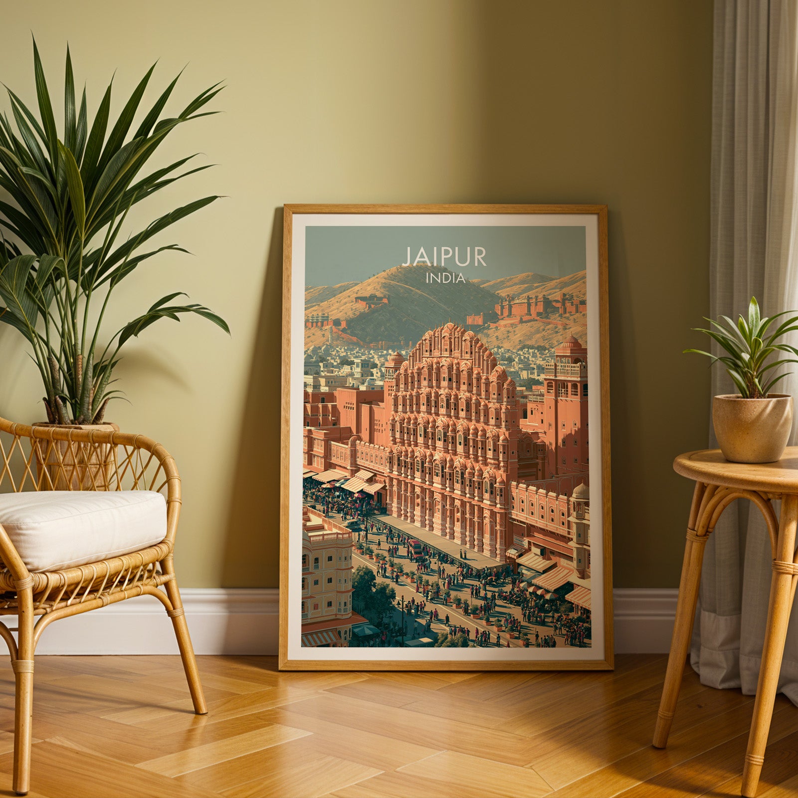 Large Hawa Mahal Jaipur India travel print in an oak frame leaning on a herringbone floor next to a rattan chair