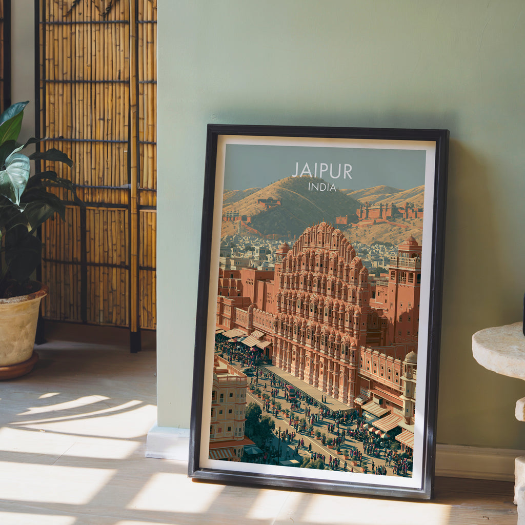 Hawa Mahal Jaipur India wall art in a black frame leaning against a sage green wall beside a bamboo screen