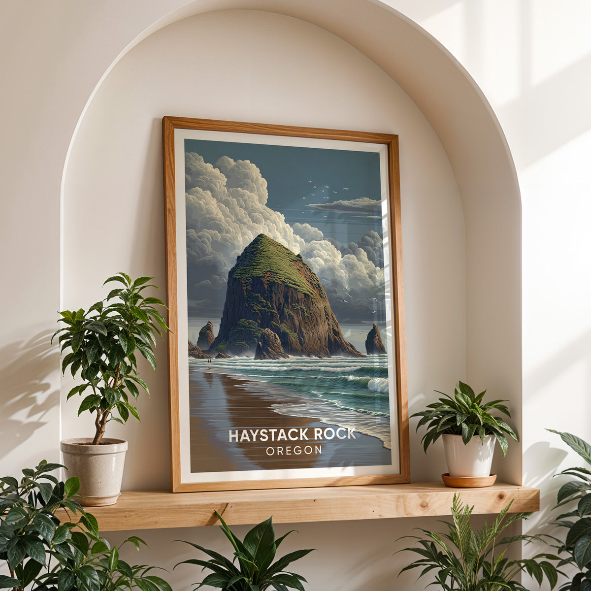 Mossy sea stack artwork in an oak frame on a shelf inside a white arched alcove flanked by potted plants