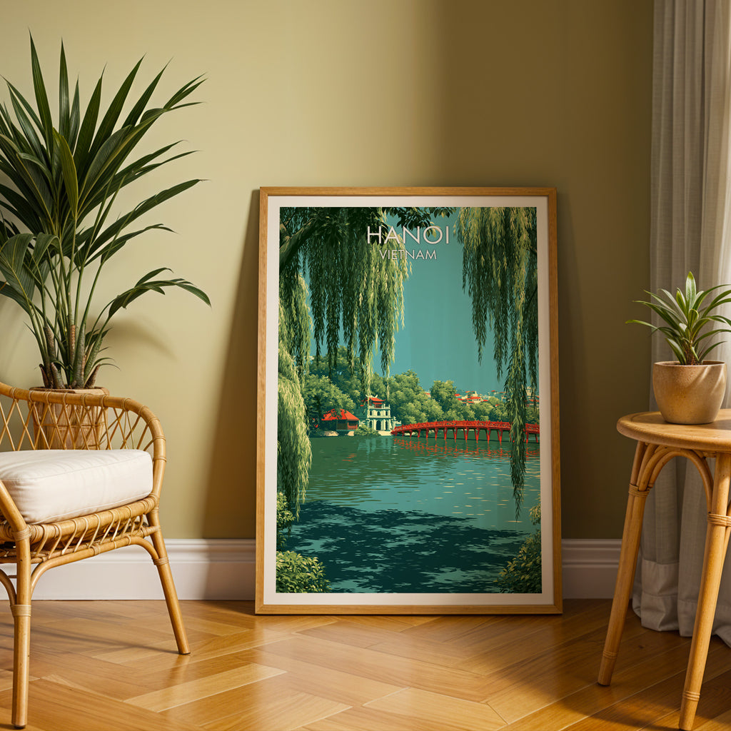 Large Hoan Kiem Lake Hanoi Vietnam travel print in an oak frame leaning on a herringbone floor next to a rattan chair