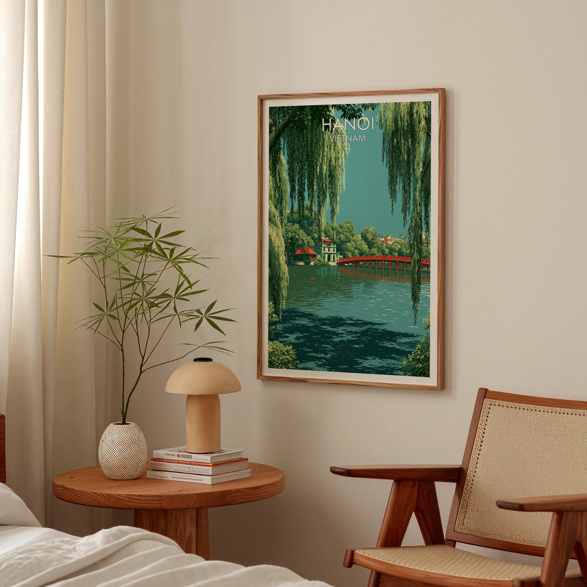 Hoan Kiem Lake Hanoi Vietnam poster above a bedroom nightstand with a bamboo plant and mushroom lamp