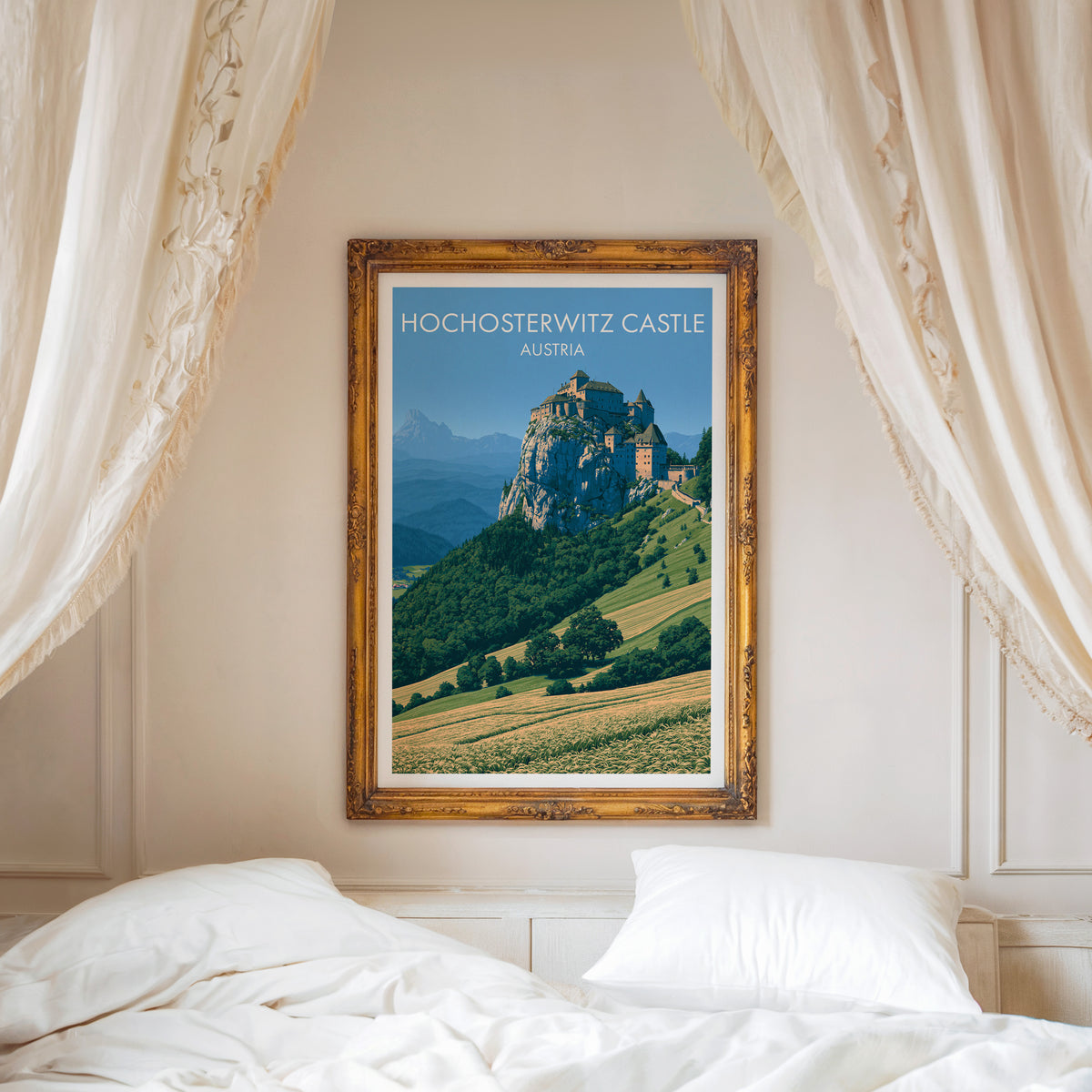 Hochosterwitz Castle poster, ornate gold frame above a white bed with linen canopy curtains