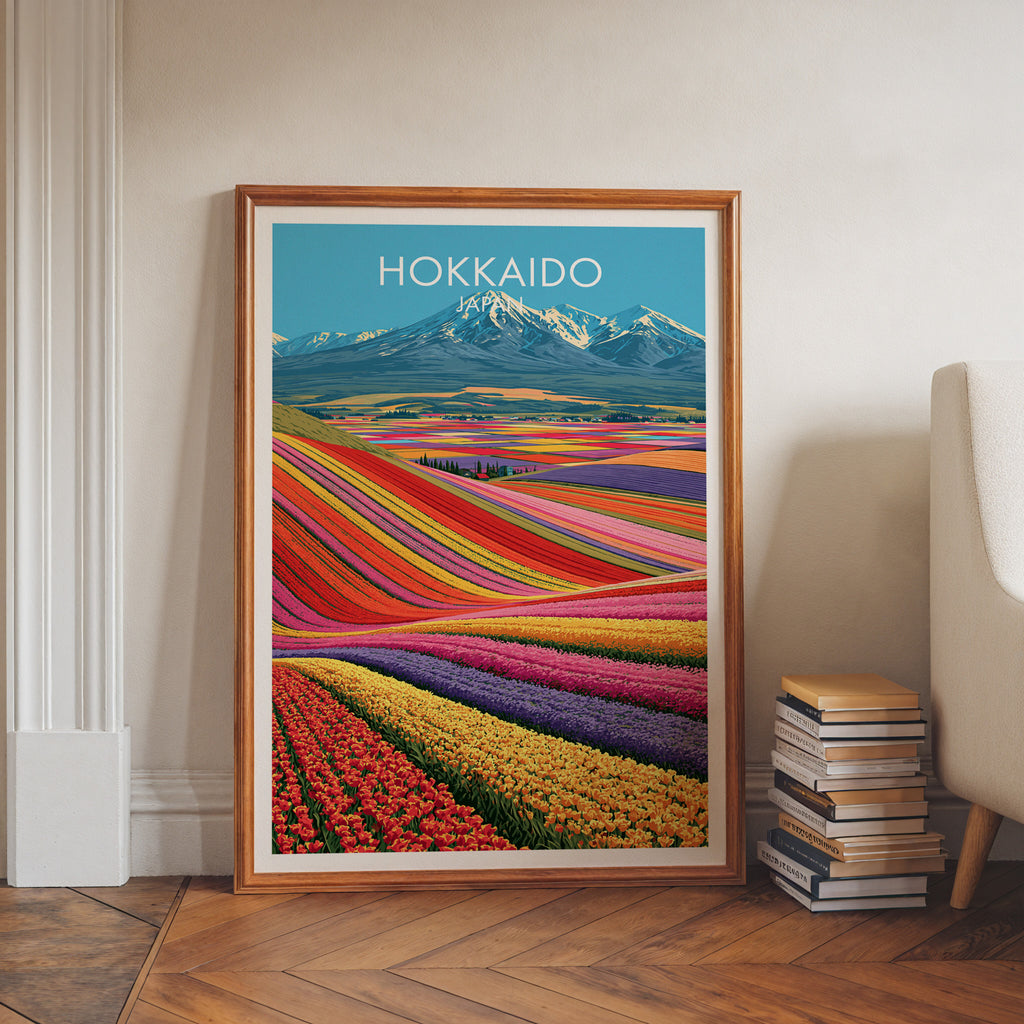 Hokkaido Japan art print in a walnut frame leaning in a hallway beside stacked books