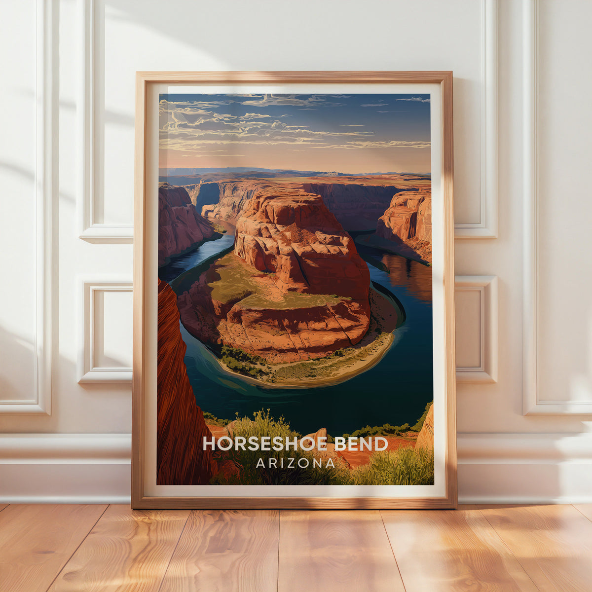 Horseshoe Bend illustrated print leaning on a textured white wall in warm window light