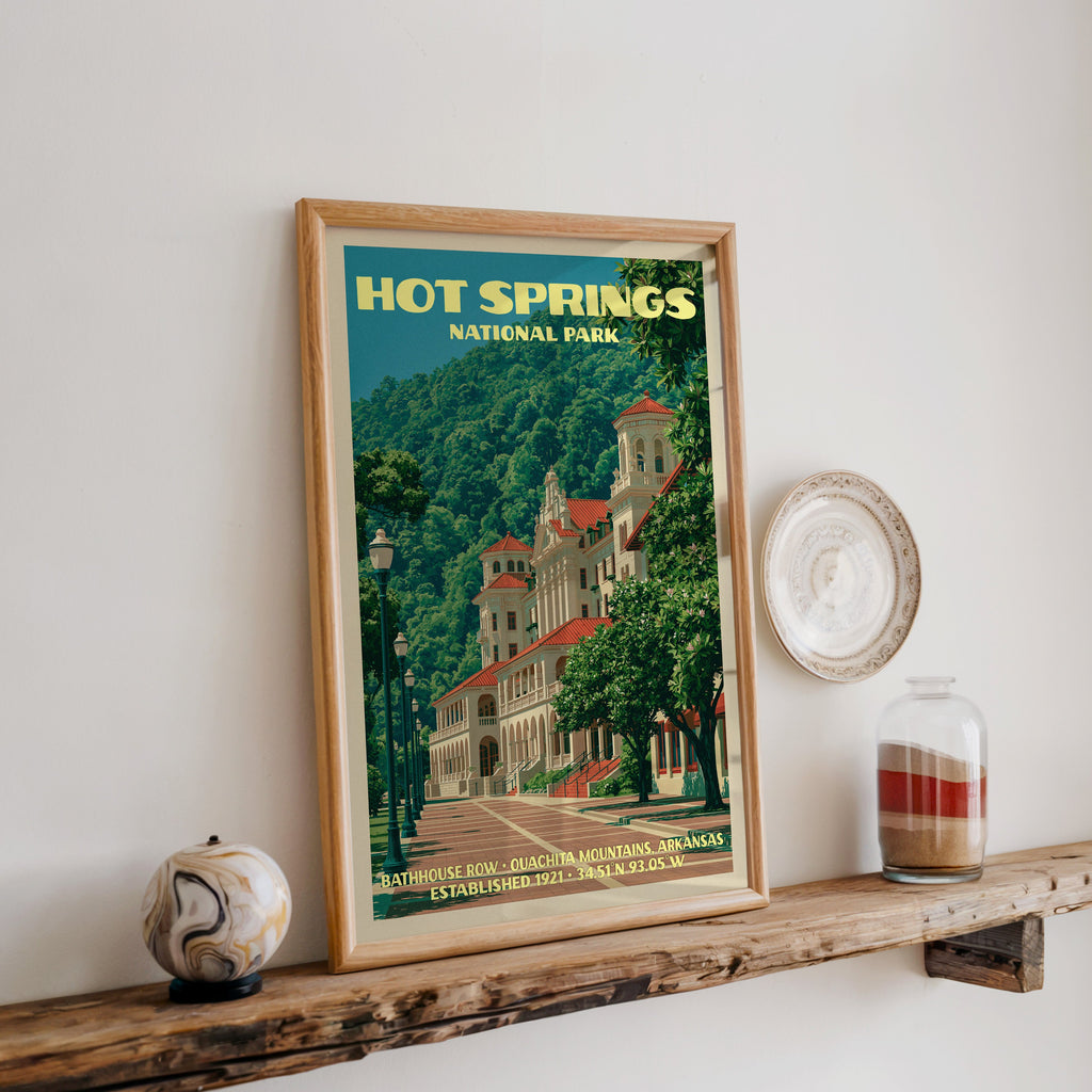 Hot Springs bathhouse print in oak, leaning on a reclaimed wood ledge with a marbled sphere and a sand jar