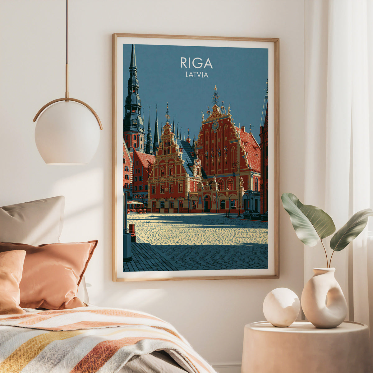 House of the Blackheads wall art, large oak frame above a bed with rust bedding and a brass globe pendant