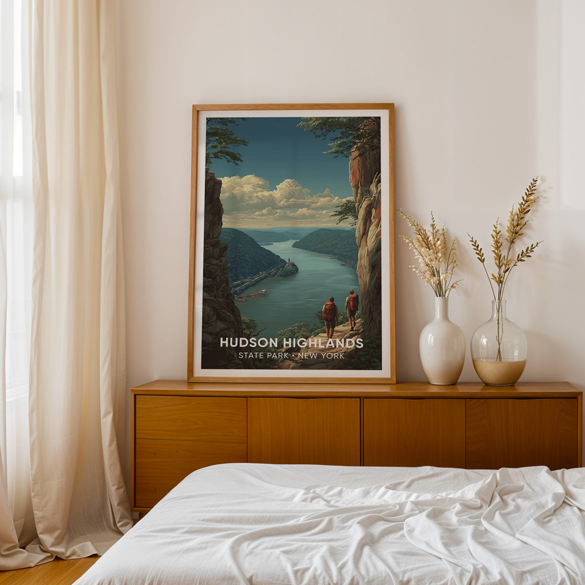 Hudson Highlands print in oak on a teak sideboard with dried pampas grass next to a bed