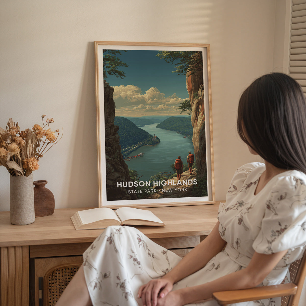 Hudson Highlands poster in oak on a sideboard of dried flowers with a woman in white seated