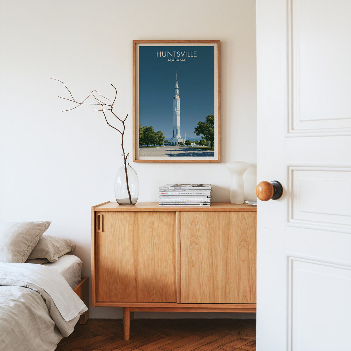 Huntsville wall print in an oak frame on a pale oak sideboard with dried branches and a white vase