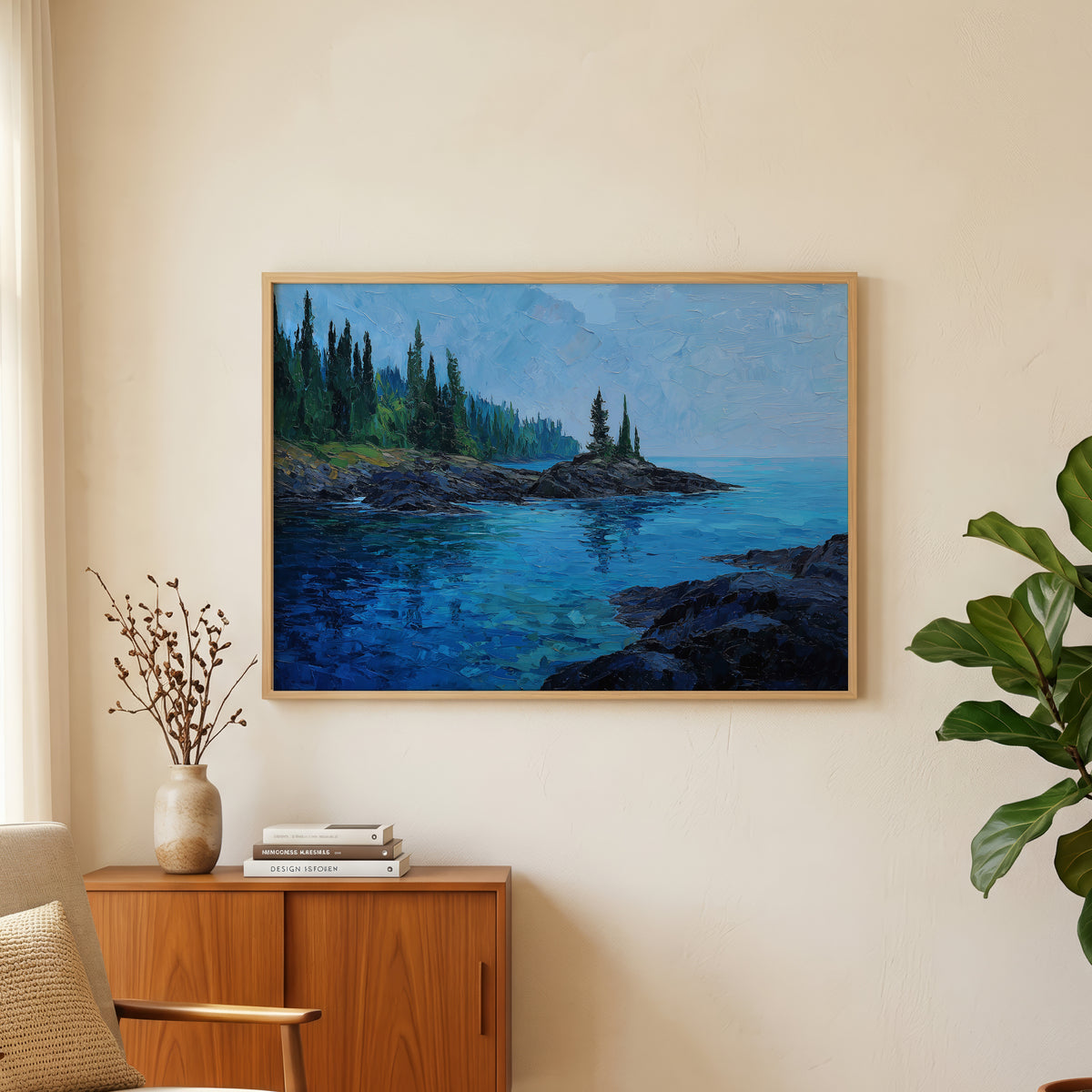 Isle Royale oil painting wall art above an oak and rattan sideboard with a lamp