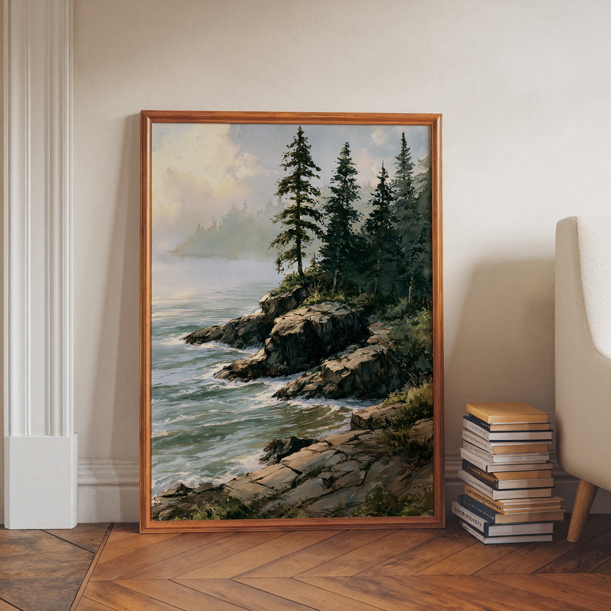 Isle Royale National Park watercolor print in a walnut frame leaning on a herringbone floor beside stacked books