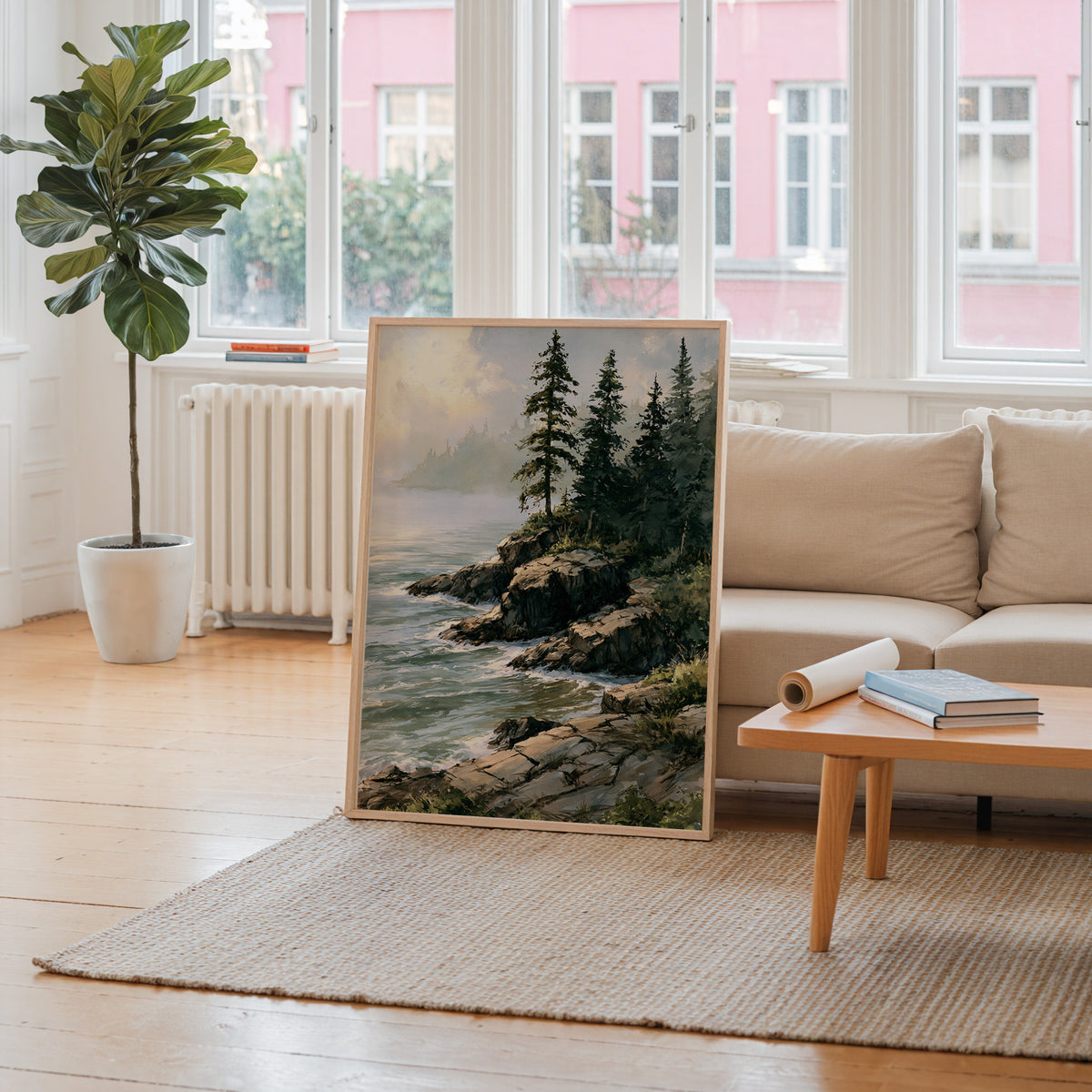 Isle Royale National Park watercolor art print leaning against a living room wall beside a linen sofa and coffee table