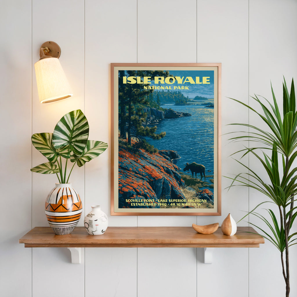 Scoville Point Isle Royale print framed on white panelling above an oak shelf with a patterned vase and sconce